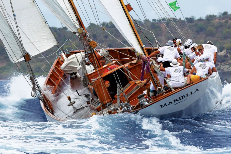 The crew of Mariella gathered on the high side as she heels through the spray off the Antigua coast at the Antigua Classic Yacht Regatta, a mid-April engagement in the season calendar of The Mansa Court