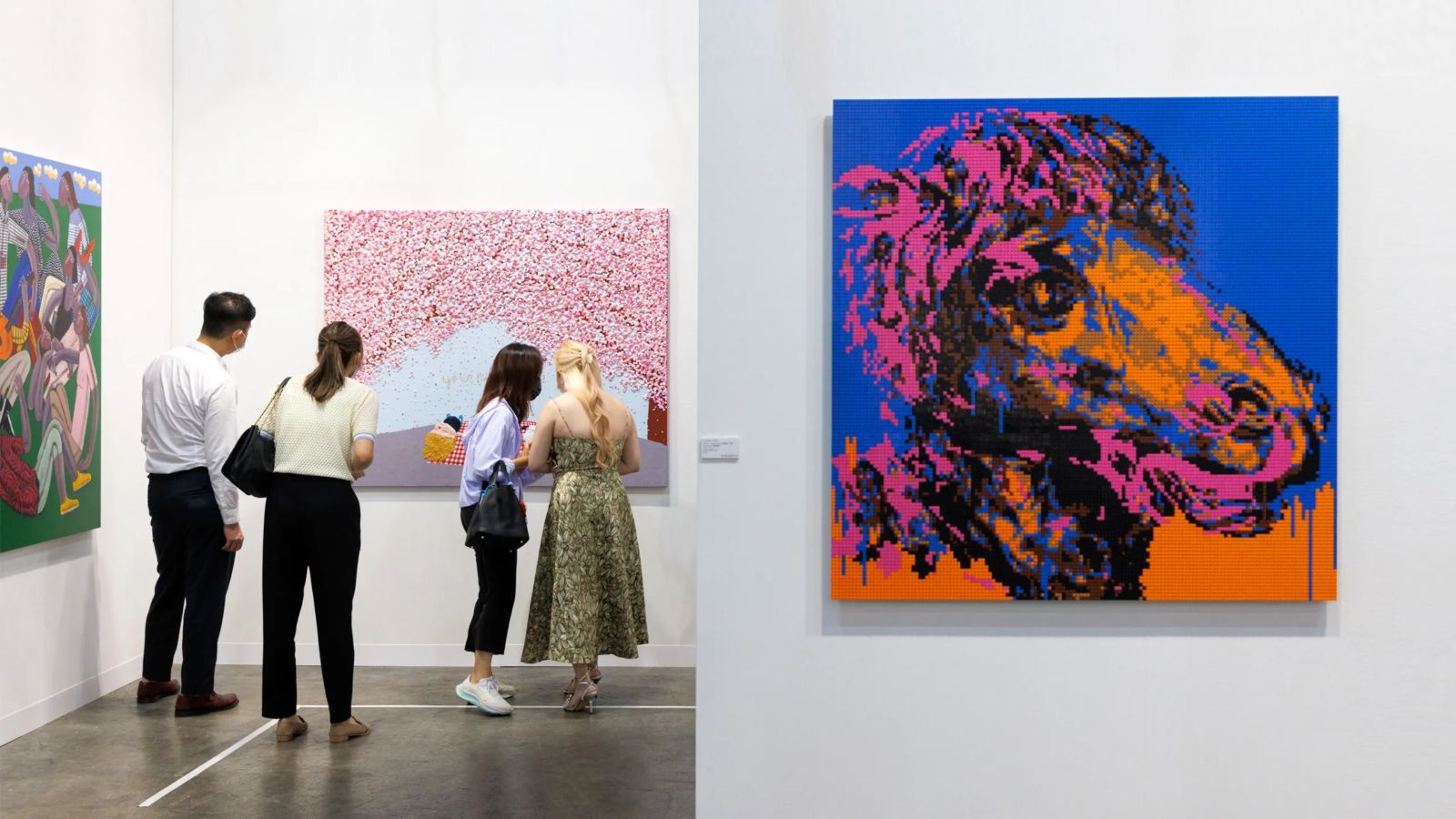 Collectors studying paintings at a gallery booth at Art Basel Hong Kong, the March fair in Wan Chai The Mansa Court attends each year