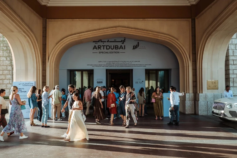 Visitors gathered beneath the arch of the Art Dubai Special Edition entrance at Madinat Jumeirah, a mid-April engagement in the season calendar of The Mansa Court