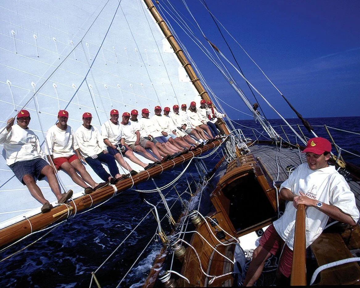 The crew of a classic yacht working the deck off Barbados