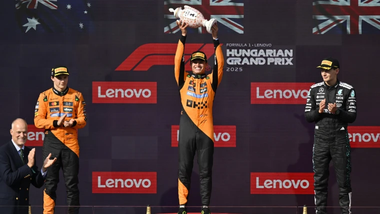 The winner lifts the trophy on the Hungaroring podium (2025). Formula 1 Hungarian Grand Prix, Hungaroring, Mogyoród (3 August 2025), in the season calendar of The Mansa Court
