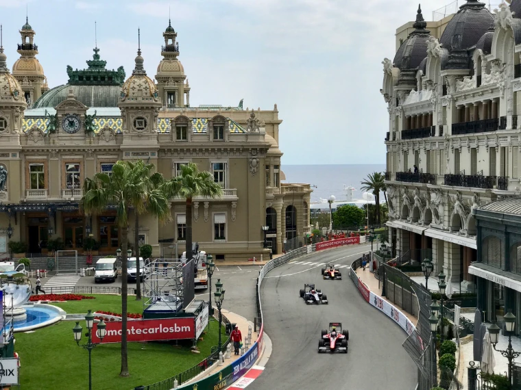 Cars climb through Casino Square between the Casino de Monte-Carlo and the Hôtel de Paris. The Formula 1 Monaco Grand Prix on the streets of Monte Carlo, in the season calendar of The Mansa Court