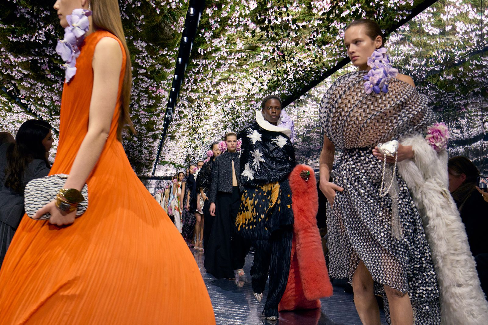 A flower-lined couture runway during Haute Couture Week in Paris