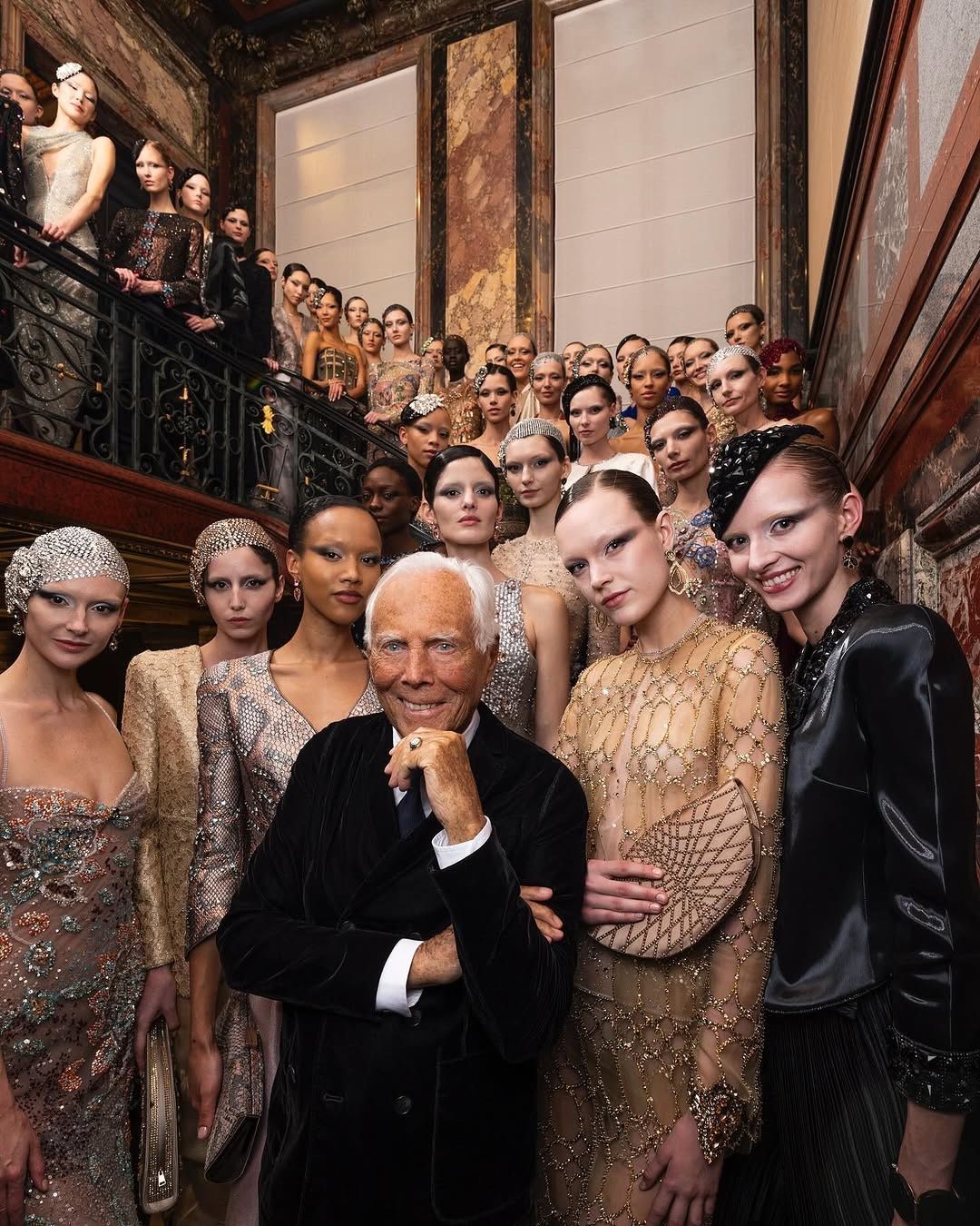 A couture finale on the staircase of a Paris salon during Haute Couture Week
