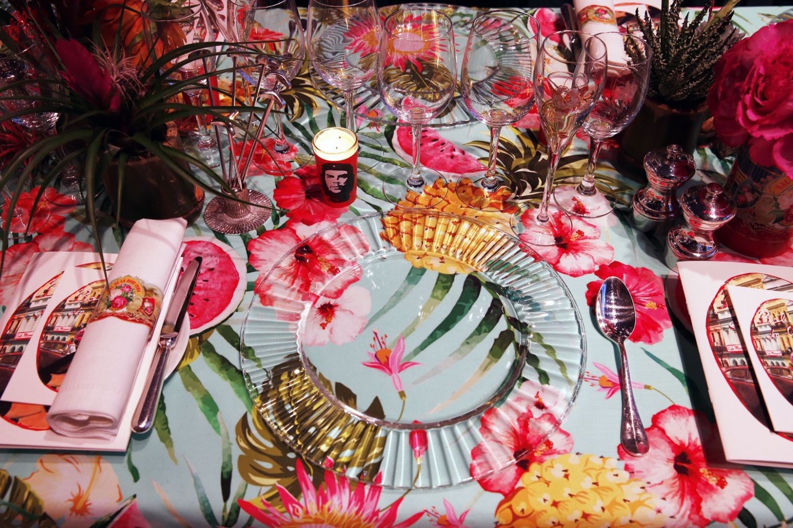 A place setting with printed menu card, floral cloth and candle at Le Bal de la Rose, Monte Carlo, attended by members of The Mansa Court