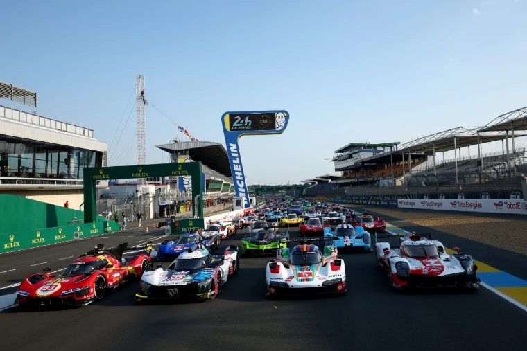 The centenary field assembled on the pit straight beneath the Michelin bridge and the grandstands at the Circuit de la Sarthe, Le Mans 24 Hours, an engagement in the season calendar of The Mansa Court