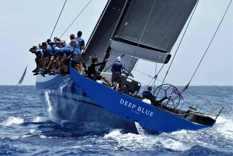 The crew of Deep Blue hiked out on the high side as she heels hard through the swell at Les Voiles de Saint-Barth, a mid-April engagement in the season calendar of The Mansa Court