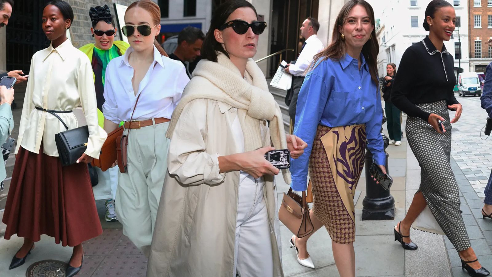 Guests photographed on the pavement between shows during London Fashion Week
