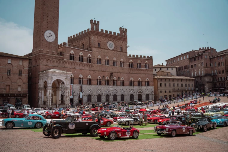 Classic cars of every era fill the Piazza del Campo beneath the Torre del Mangia and the Palazzo Pubblico. The Mille Miglia, from Brescia to Rome and back, in the season calendar of The Mansa Court