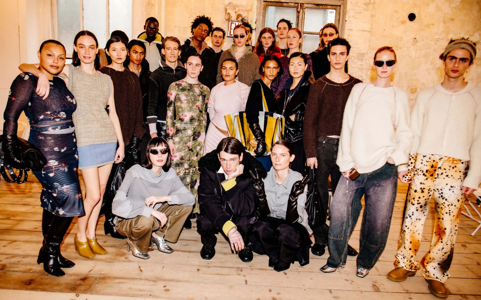 The full cast of a New York Fashion Week show gathered for a portrait in a downtown loft