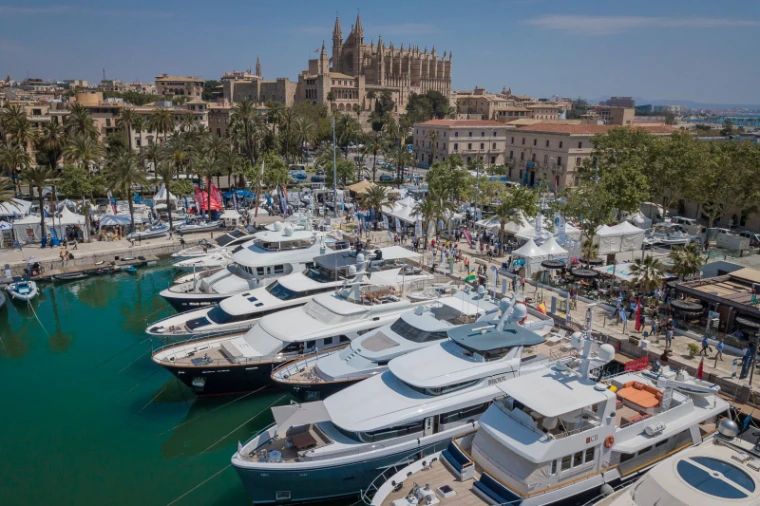 Superyachts berthed stern-to along the quay below the cathedral and the show pavilions at the Palma International Boat Show, a late-April engagement in the season calendar of The Mansa Court