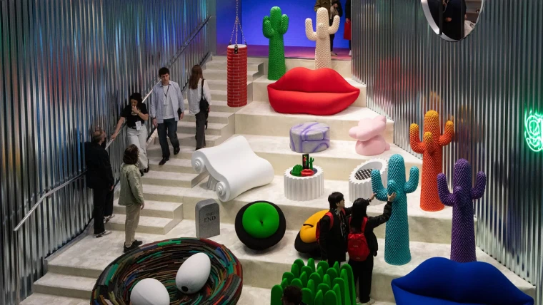 Gufram cactus coat stands, lips sofas and pop furniture arranged on a white stair between corrugated steel walls at the Salone del Mobile.Milano, an April engagement in the season calendar of The Mansa Court