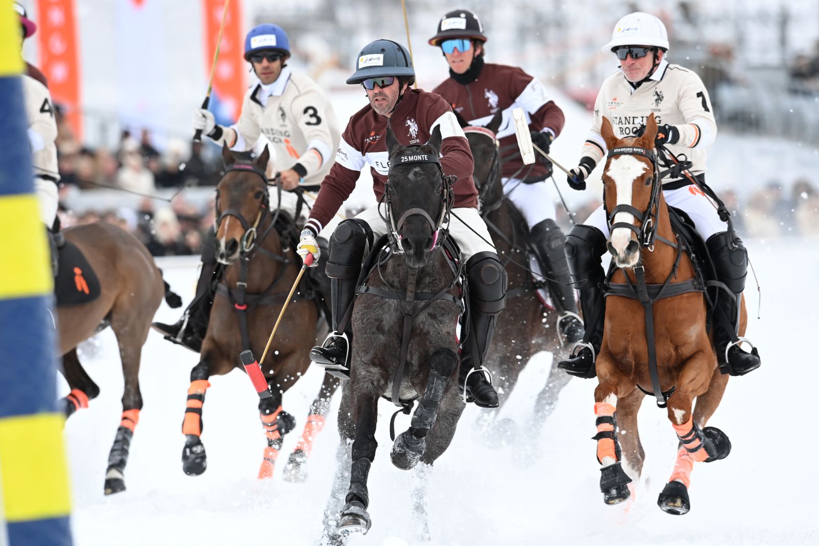 High-goal polo on the frozen lake at St. Moritz, ponies at full stretch on the snow