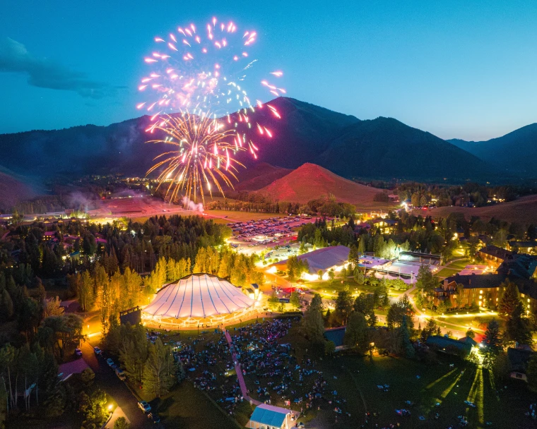 Fireworks over the Sun Valley Pavilion on the Fourth of July, the lawn full beneath them (2023).