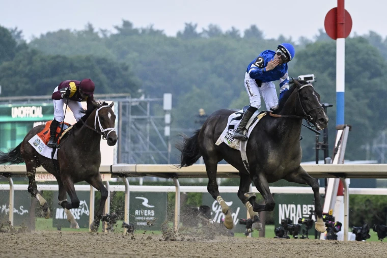 The winning jockey blows a kiss as his colt crosses the line clear. The Belmont Stakes, the final leg of the Triple Crown, in the season calendar of The Mansa Court