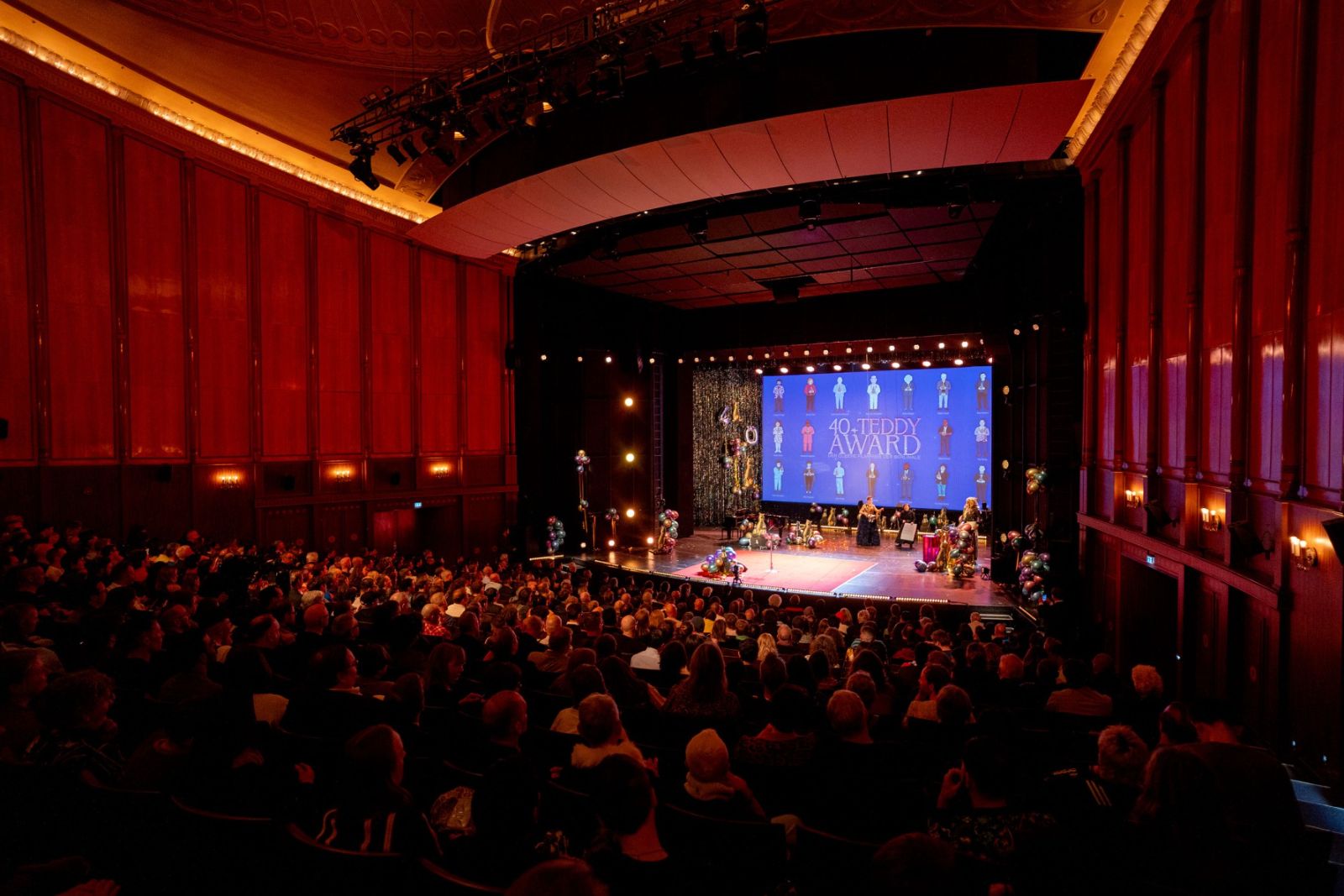 A full house in a red-panelled theatre for the Teddy Award ceremony at The Berlinale