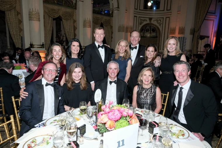 Guests in black tie gathered at their table among the gilded columns of the ballroom at The British Ball in New York, an April engagement in the season calendar of The Mansa Court