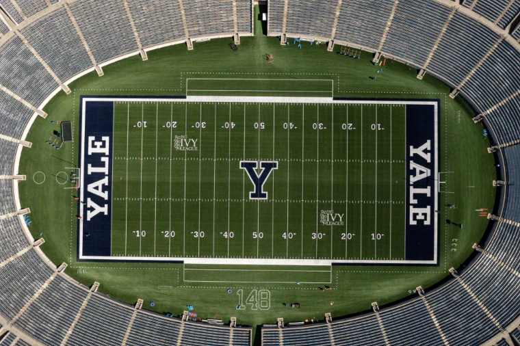 The Yale Bowl from the air, YALE painted in both end zones (2021). The Yale Bowl, New Haven, Connecticut, shown for The Game, Harvard v Yale in the season calendar of The Mansa Court