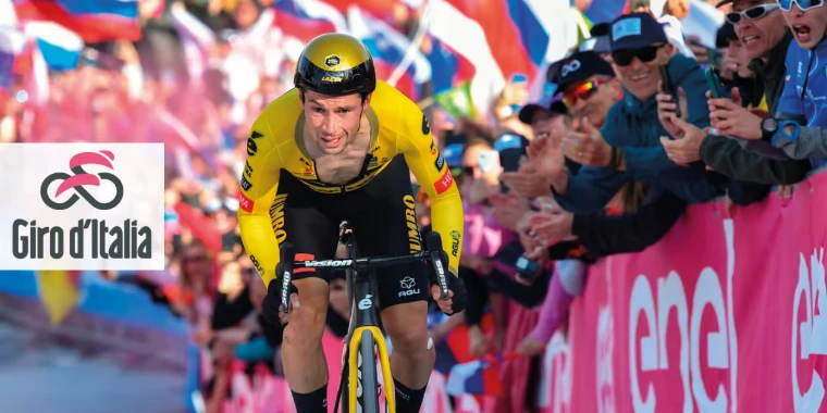 A rider in yellow climbs through a roaring crowd behind the barriers in a mountain time trial. The Giro d’Italia, in the season calendar of The Mansa Court