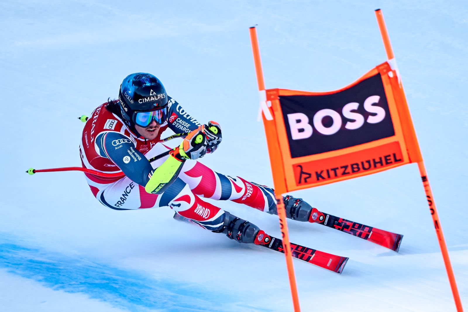 A racer carving a gate in the Super-G at the Hahnenkamm Races