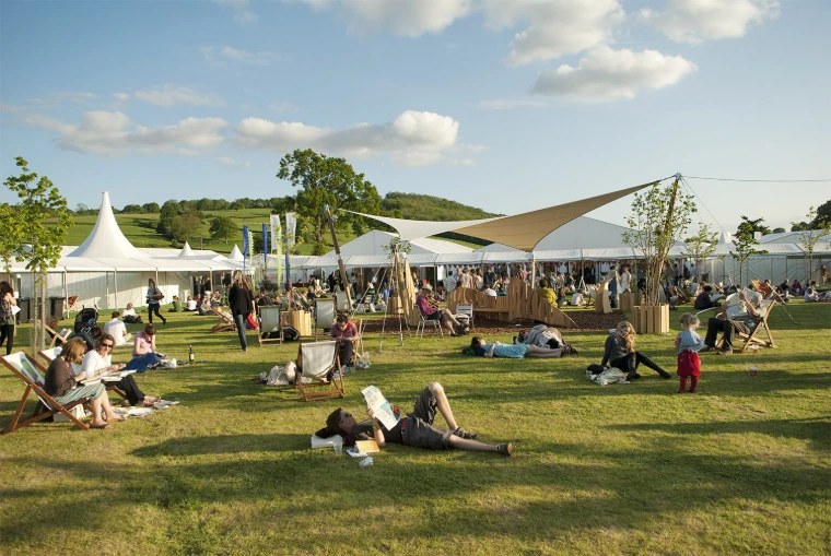 An afternoon on the green among the festival tents, the Black Mountains beyond (2009). The Hay Festival at Hay-on-Wye, on the Welsh border, in the season calendar of The Mansa Court