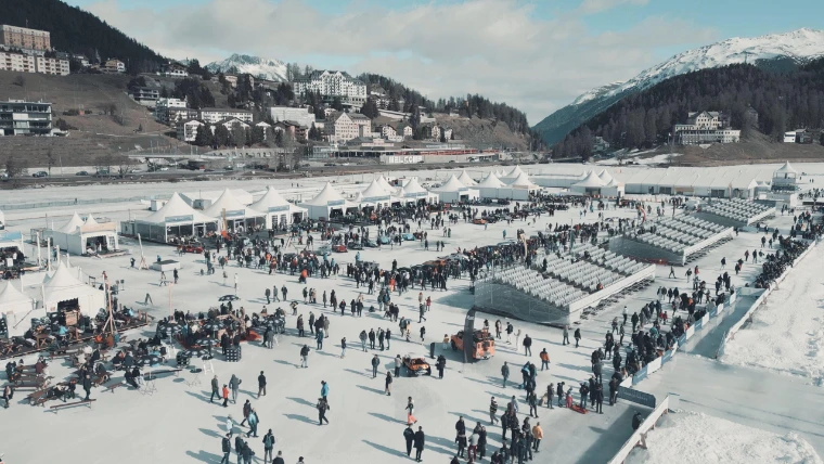 The I.C.E. Village on the frozen lake, with the town and the Engadin mountains behind. The I.C.E. St. Moritz, Lake St. Moritz, St. Moritz, Switzerland, in the season calendar of The Mansa Court