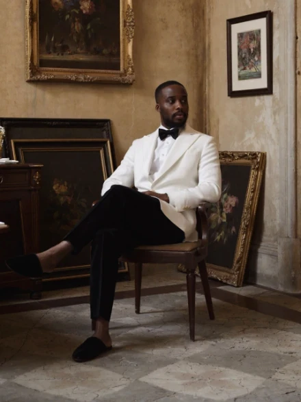 Jimi&nbsp;A.&nbsp;F., founder of The Mansa Court, in a white dinner jacket and black tie.