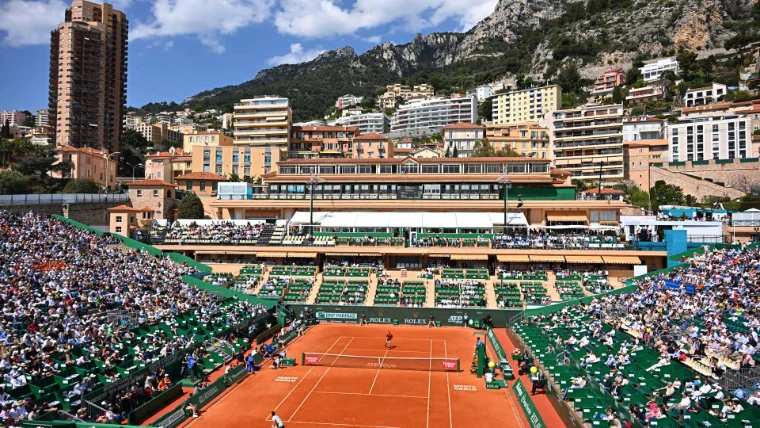 Court Rainier III at the Monte-Carlo Country Club, its stands full beneath the terraced apartments and limestone cliffs above Monaco, during the Rolex Monte-Carlo Masters, an April engagement in the season calendar of The Mansa Court