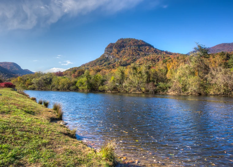 The Broad River beneath a wooded mountain in autumn colour under a blue sky (2013).