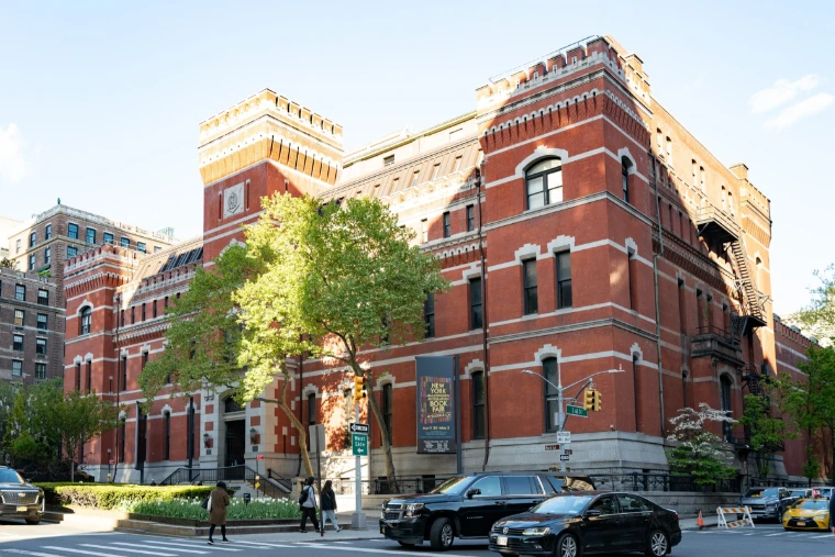 The red-brick Park Avenue Armory on a spring afternoon, the fair’s banner over the entrance. The New York International Antiquarian Book Fair, Park Avenue Armory, 643 Park Avenue, New York, in the season calendar of The Mansa Court