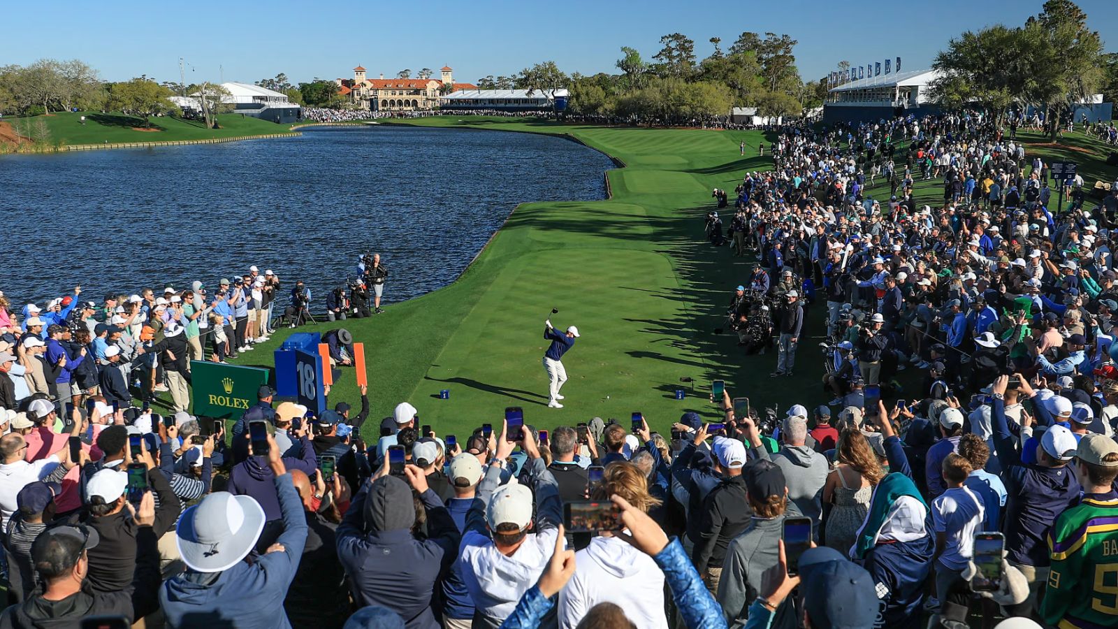 A tee shot down the water’s edge on the eighteenth before the clubhouse at The Players Championship, TPC Sawgrass, an engagement in The Mansa Court season