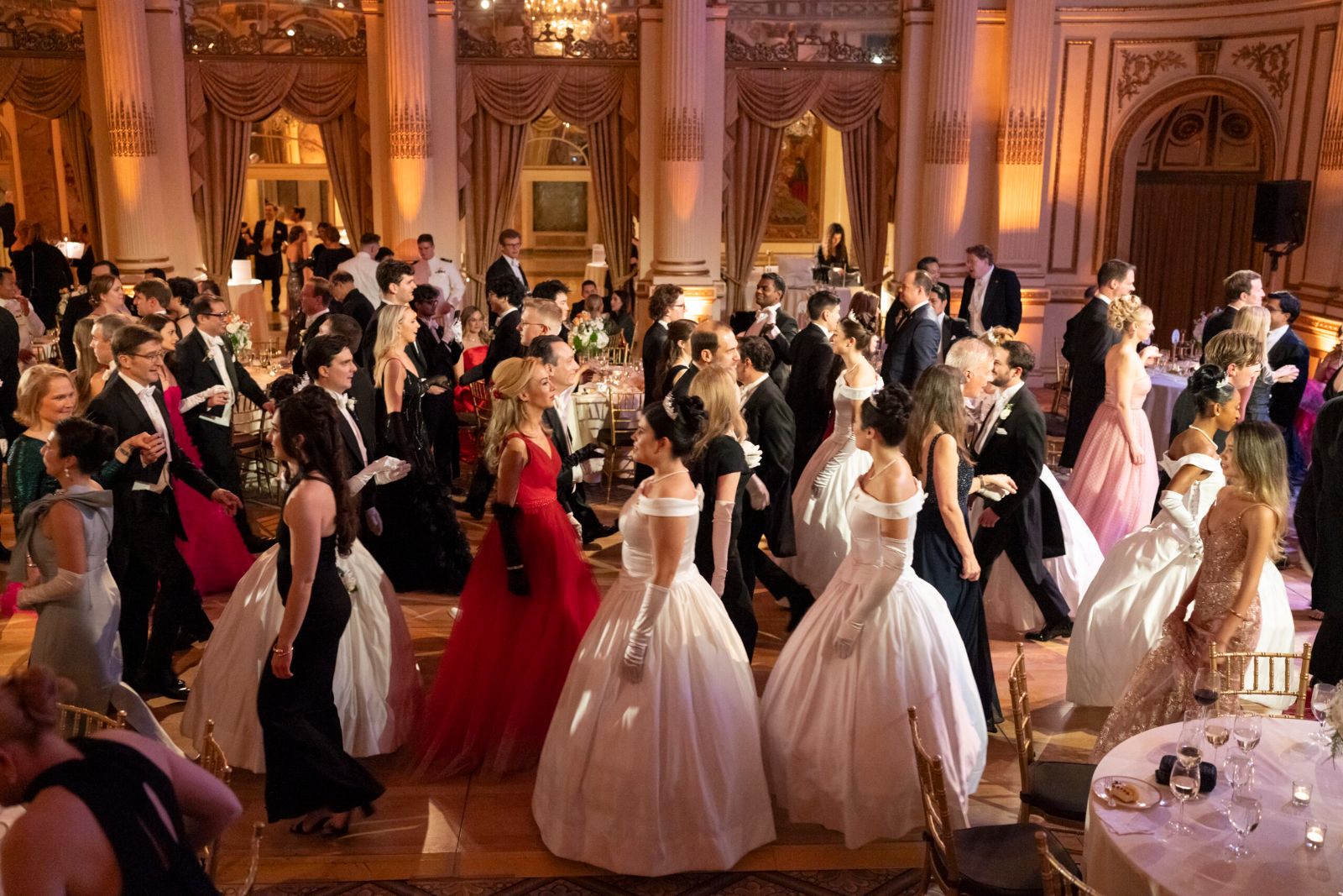 Guests in white tie dancing in the Grand Ballroom of The Plaza during The Quadrille Ball, New York
