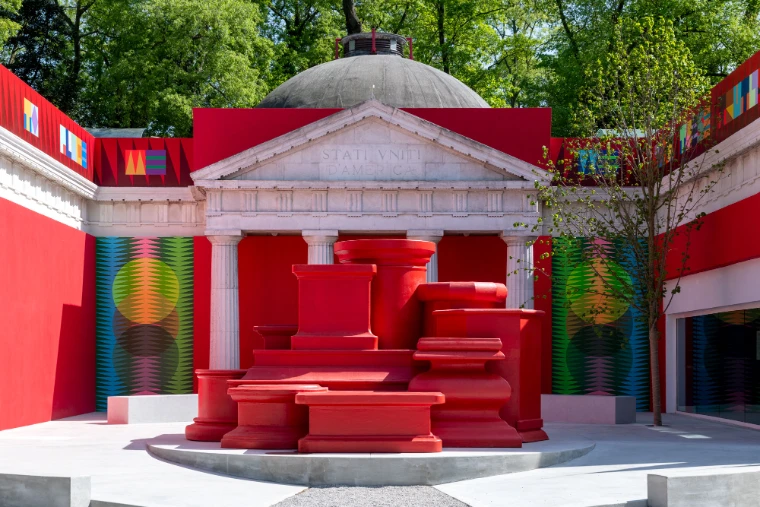 Red plinths and patterned murals in the forecourt of the United States Pavilion for Jeffrey Gibson’s the space in which to place me at the 2024 Venice Biennale, an engagement in the season calendar of The Mansa Court