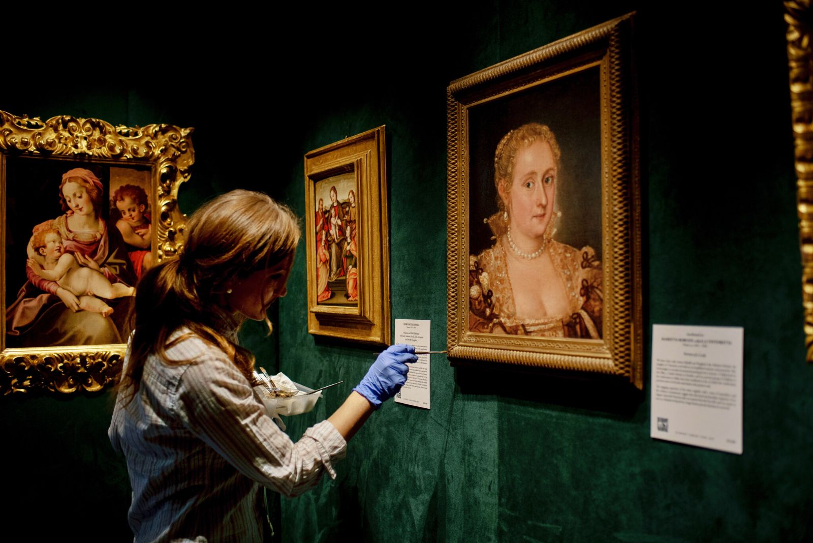 Old master paintings hung on a dealer's stand at the Winter Show