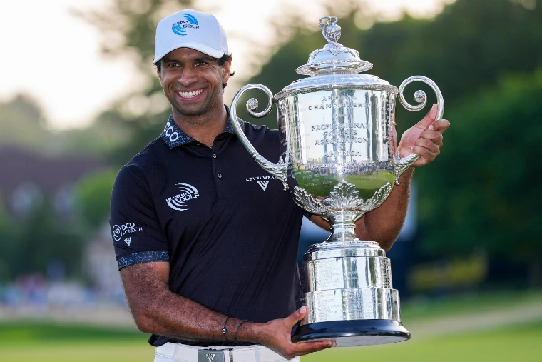 The new champion smiles with the Wanamaker Trophy on the final green at dusk. The PGA Championship, at US PGA Championship, in the season calendar of The Mansa Court