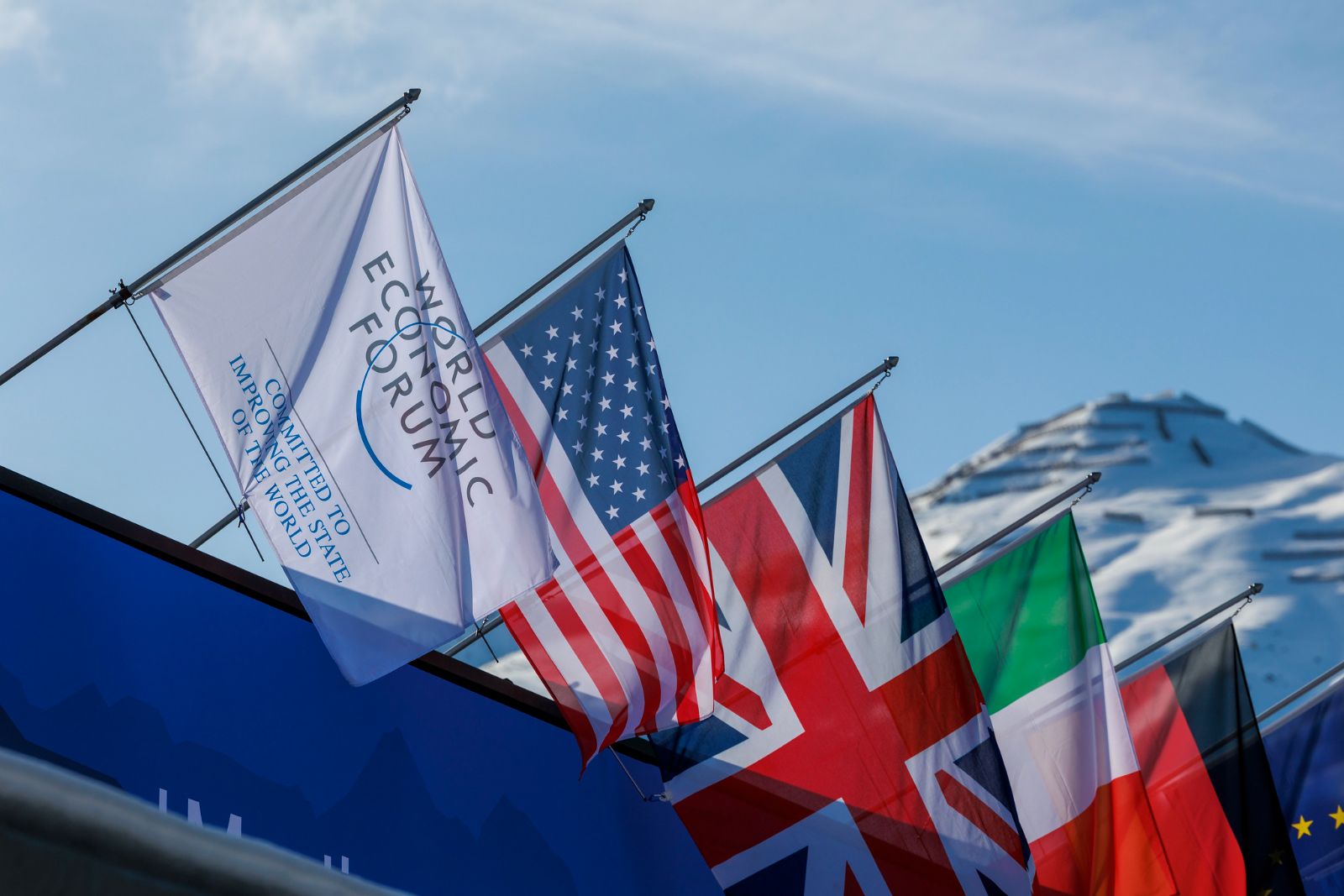 Flags along the snowbound Promenade at Davos during the Forum week